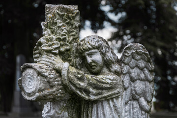 Little angel crying. Stone statue. (concept children's mortality)