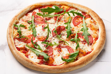 Italian Pizza with tomatoes, cheese, arugula and tomato sauce
