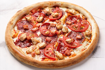 Italian Pizza with chicken, salami. tomatoes, cheese, tomato sauce