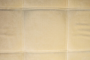 light cream sofa background texture. horizontal. close up. simple design of plain furniture. interior home design. Housing. bright hues. material for selling upholstered furniture. simplicity.