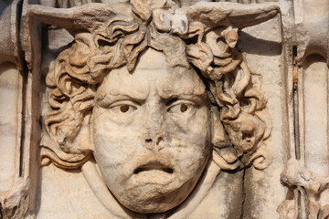 Fototapeta na wymiar Close-up of Medusa, Archaeological Roman sculpture ruins, Ancient City Side Antalya
