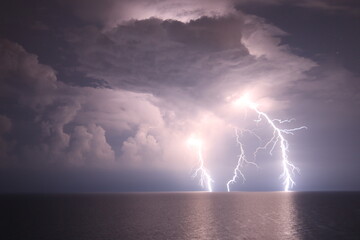 Naklejka na ściany i meble lightning over the sea