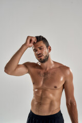 Fototapeta premium Young exhausted caucasian male athlete during training