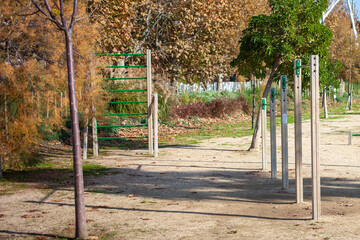 Fototapeta na wymiar Fall. Pull-up bars and ladder for outdoor sports.
