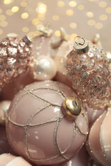 Collection of beautiful Christmas tree baubles against blurred festive lights, closeup