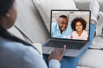 African American Family Making Video Call On Laptop At Home