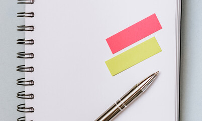 Business flat lay with office notepad, sticker and pen