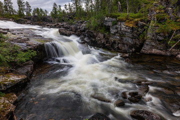 Beautiful landscape of the river and waterfall with long exposure, Norway