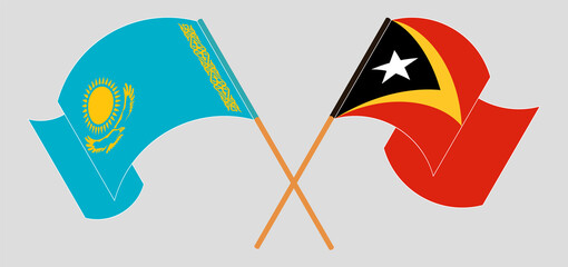 Crossed and waving flags of Kazakhstan and East Timor