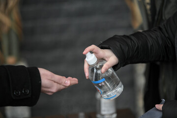 Visitors must go through fever measures using hand sanitizer spray measurement, fever examination at the building.Measures to prevent people with fever,Corona virus,Covid-19.