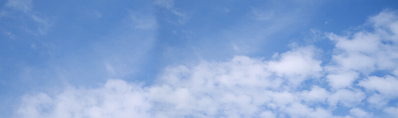 beautiful blue sky with white fluffy clouds, sun rays illuminate heavenly landscape, concept natural, seasonal, divine love, eternity