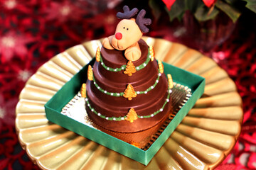 Christmas sweets and cakes. Decorate table with delicious Christmas sweets, chocolate and candys. Santa Claus, bear and others