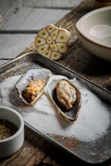 Mussels in wine with parsley and garlic. Seafood. Clams in the shells. Delicious snack for gourmands. Selective focus