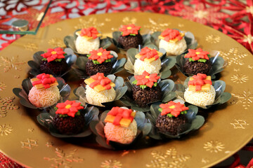 Christmas sweets and cakes. Decorate table with delicious Christmas sweets, chocolate and candys. Santa Claus, bear and others