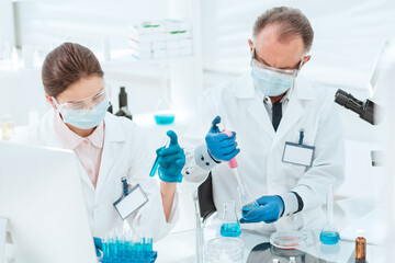 close up. researchers work with tests in the laboratory.