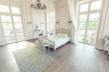 Naklejka na ściany i meble beautiful white bright clean interior bedroom in luxurious baroque style.