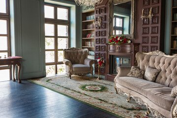 Luxury interior of home library. Sitting room with elegant furniture
