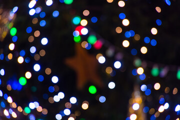 Colorful abstract bokeh background. Winter decorations, at night.