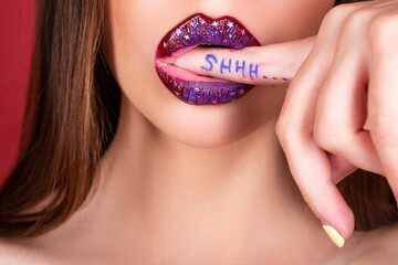 Shhh woman. Shh, Womens secrets. Female with finger in mouth. Closeup of young woman is showing a...