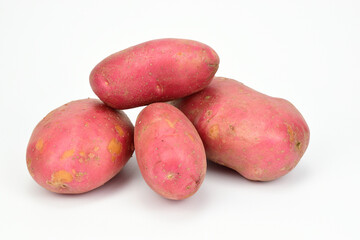 Small pile of red potatoes isolated on white background.