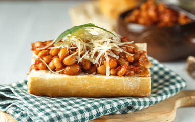 Vegetarian sandwich with baked beans and soy cheese. Varied food, lenten menu
