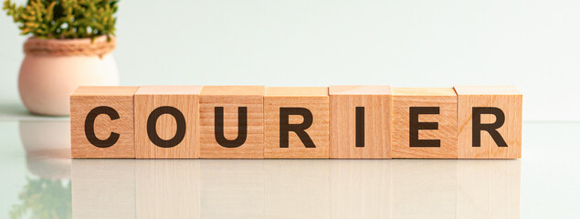 courier motivation text on wooden blocks business concept white background. Front view concepts,...