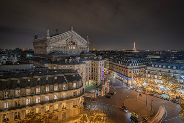 Paris, France - 11 30 2020: Boulevard Haussmann. Panoramic view of Paris from the roofs of...