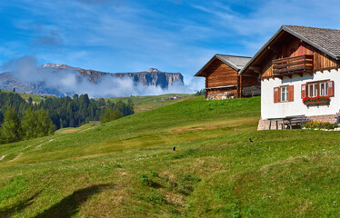 Fototapeta na wymiar Traditional wooden house in the Dolomite alps, Italy