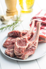 Slices raw lamb chops on plate