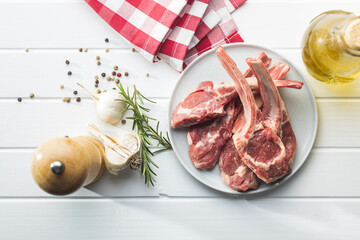 Slices raw lamb chops on plate