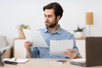 Serious Businessman Entrepreneur Reading Business Correspondence Working Sitting In Office