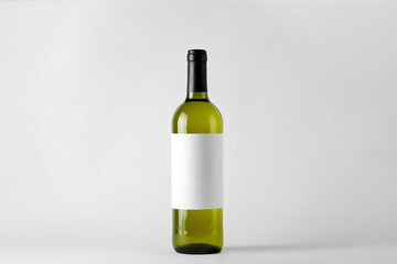 Green wine bottle with white wine isolated on white