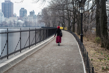 Woman with red hat, Central Park, New York City, USA