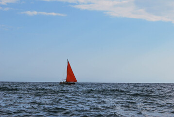 boat with red sail