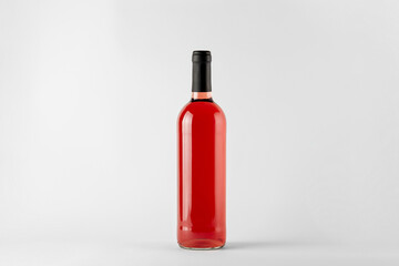 Red wine bottle with rose wine isolated on white