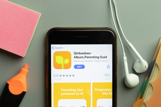 New York, USA - 1 December 2020: Qinbaobao mobile app icon on phone screen top view, Illustrative Editorial