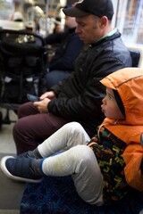oddler boy and father taking public transport - close up