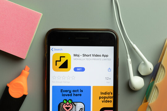 New York, USA - 1 December 2020: Moj mobile app icon on phone screen top view, Illustrative Editorial