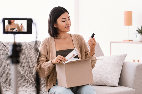 Asian Woman Recording Product Review For Beauty Blog