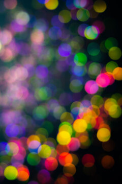 Night colorful city light black overlay background. Glow defocused, holographic bokeh ray. Shine christmas decoration abstract blurred bokeh effect. New year holo flare reflection. festive wallpaper