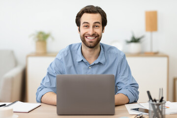 Excited Businessman At Laptop Working Online Posing In Home Office