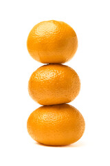 Tangerine snowman. Three tangerines lined up on top of each other in the shape of a snowman.
