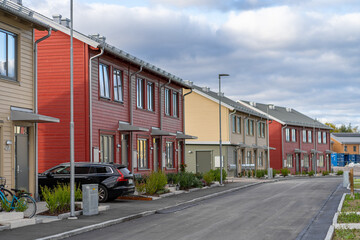 Street with Scandinavian style townhouses or condominium apartments 