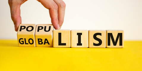 Populism or globalism. Hand turns cubes and changes word 'globalism' to 'populism'. Beautiful...