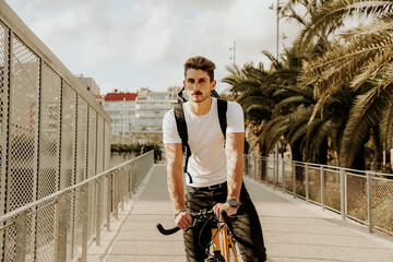 Outdoor shot of hipster on bike in the city. Lifestyle concept.