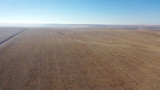 Aerial view of dry farmland that has already been cut and harvested