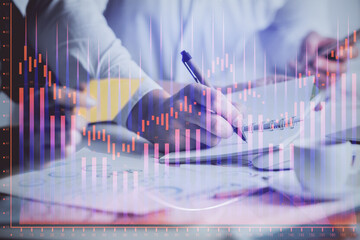 Double exposure of forex graph drawing over people taking notes background. Concept of financial analysis