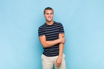 blonde  man laughing shyly and cheerfully, with a friendly and positive but insecure attitude