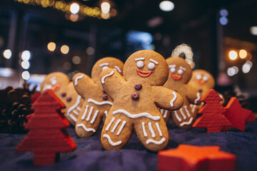 Many Christmas cookies in the form of gingerbread men depicting people celebrating the New Year in...