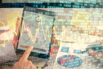 Fototapeta na wymiar Multi exposure of man's hands holding and using a phone and financial chart drawing. Market analysis concept.